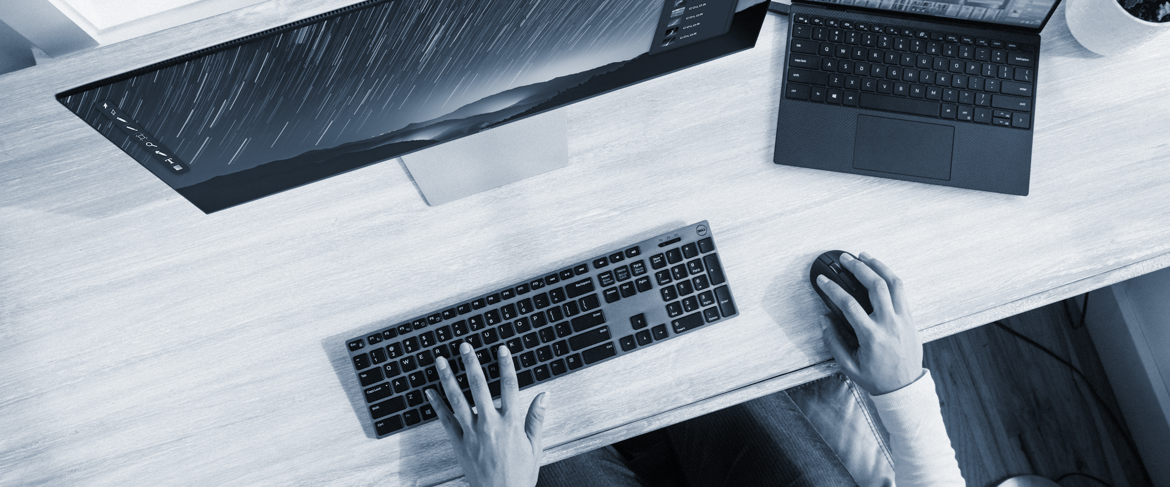 Business owner working on desktop computer while hiring a web developer