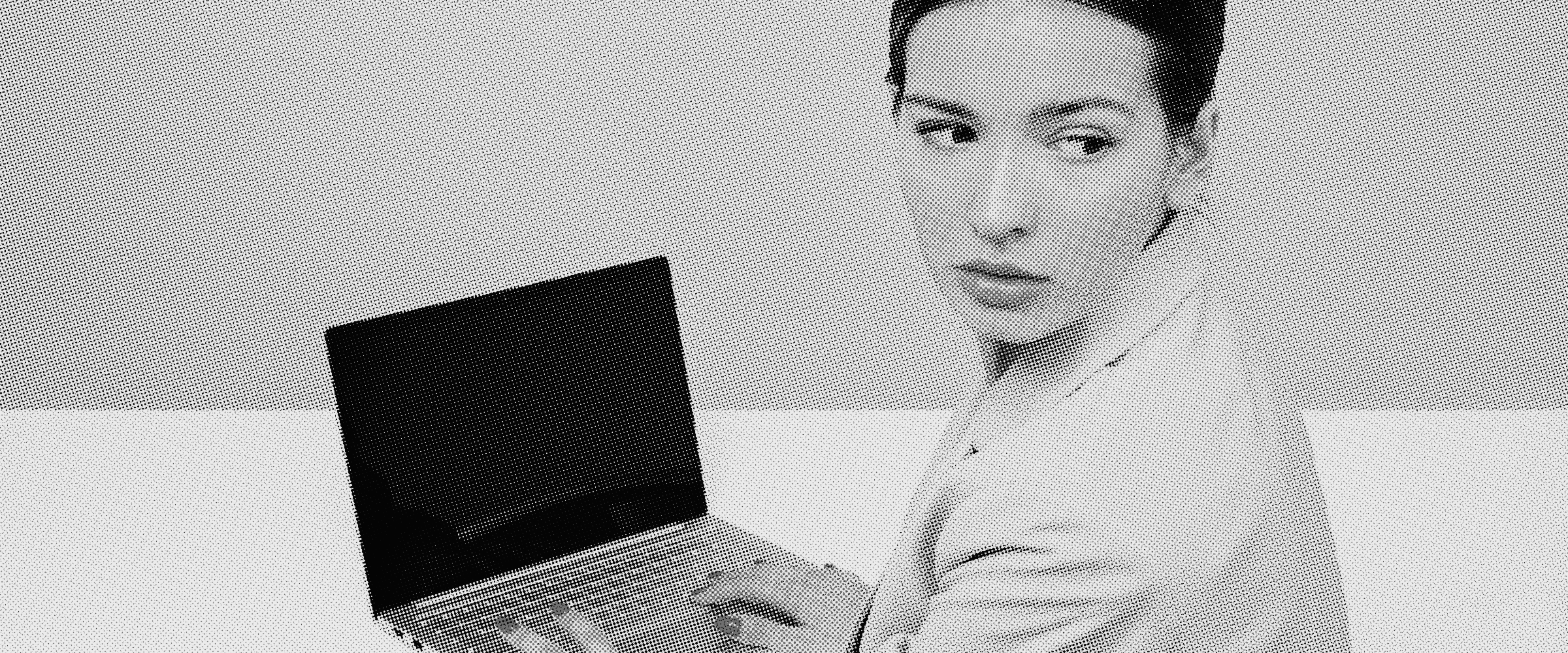 Professional working on a laptop, illustrating common mistakes businesses make when choosing a web development programming language for a project.
