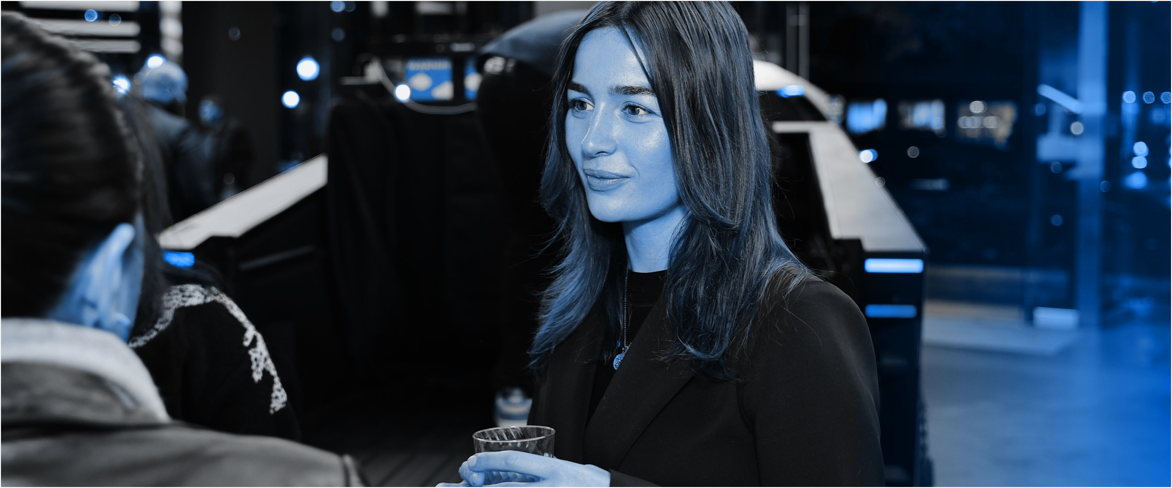 Business professionals in discussion at a networking event, representing warning signs and red flags to watch for when evaluating a web development agency or software development partner.