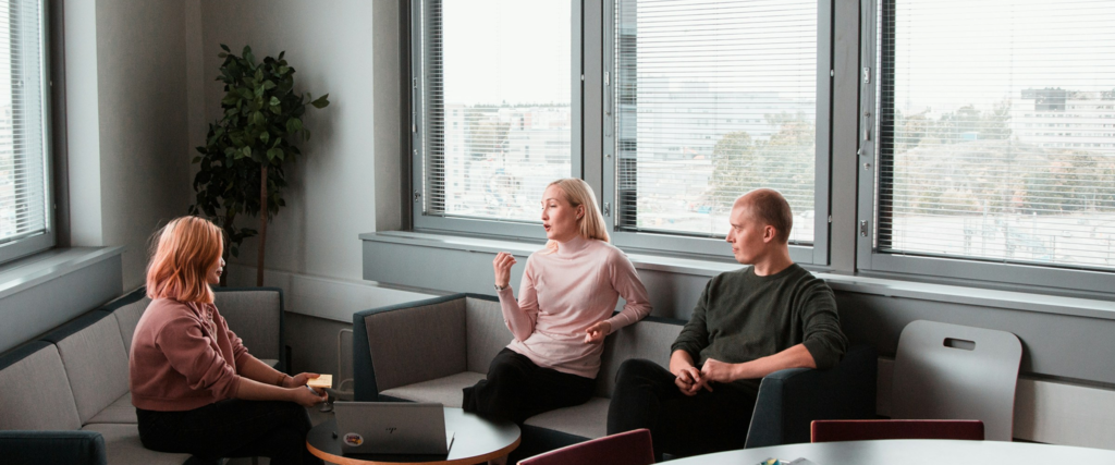 Client and web development team discussing project requirements during a meeting