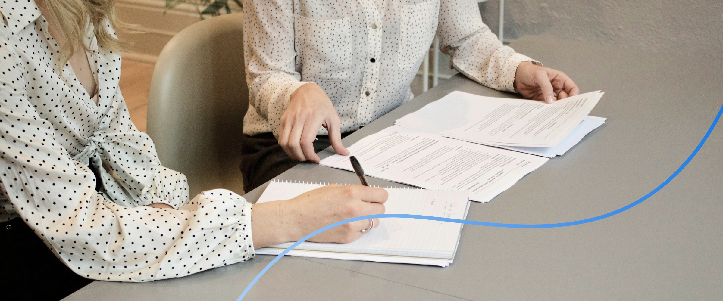 Business professionals reviewing project requirements for a web development project brief